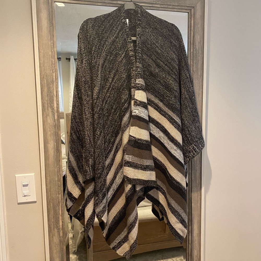 Beautiful BCBG boho shawl sweater. It’s very soft and warm; actually never worn.